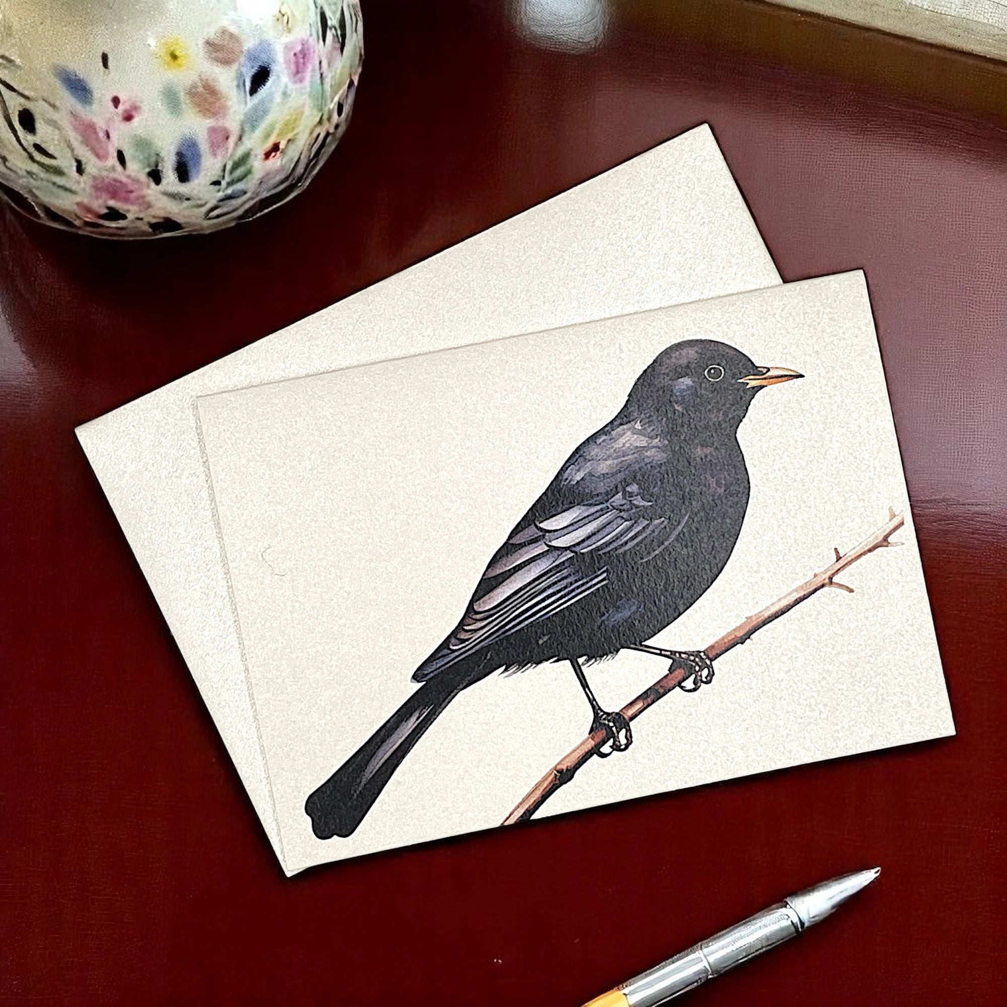 Klappkarte mit einer schwarzen Amsel