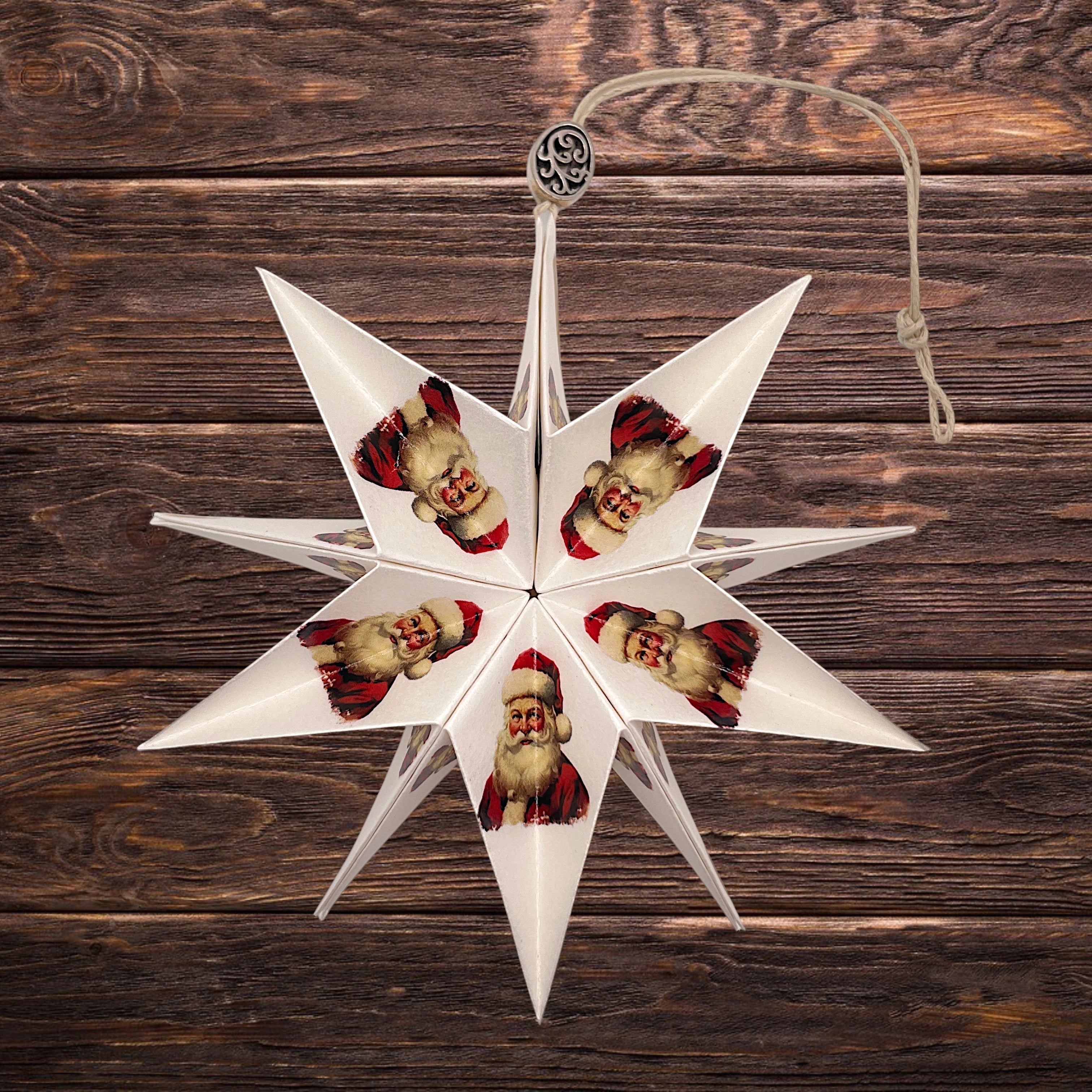 Fensterstern mit Weihnachtsmann von Manufaktur Graue – handgefertigter Papierstern für Adventszeit, Weihnachtsdeko und festliche Wohnräume.