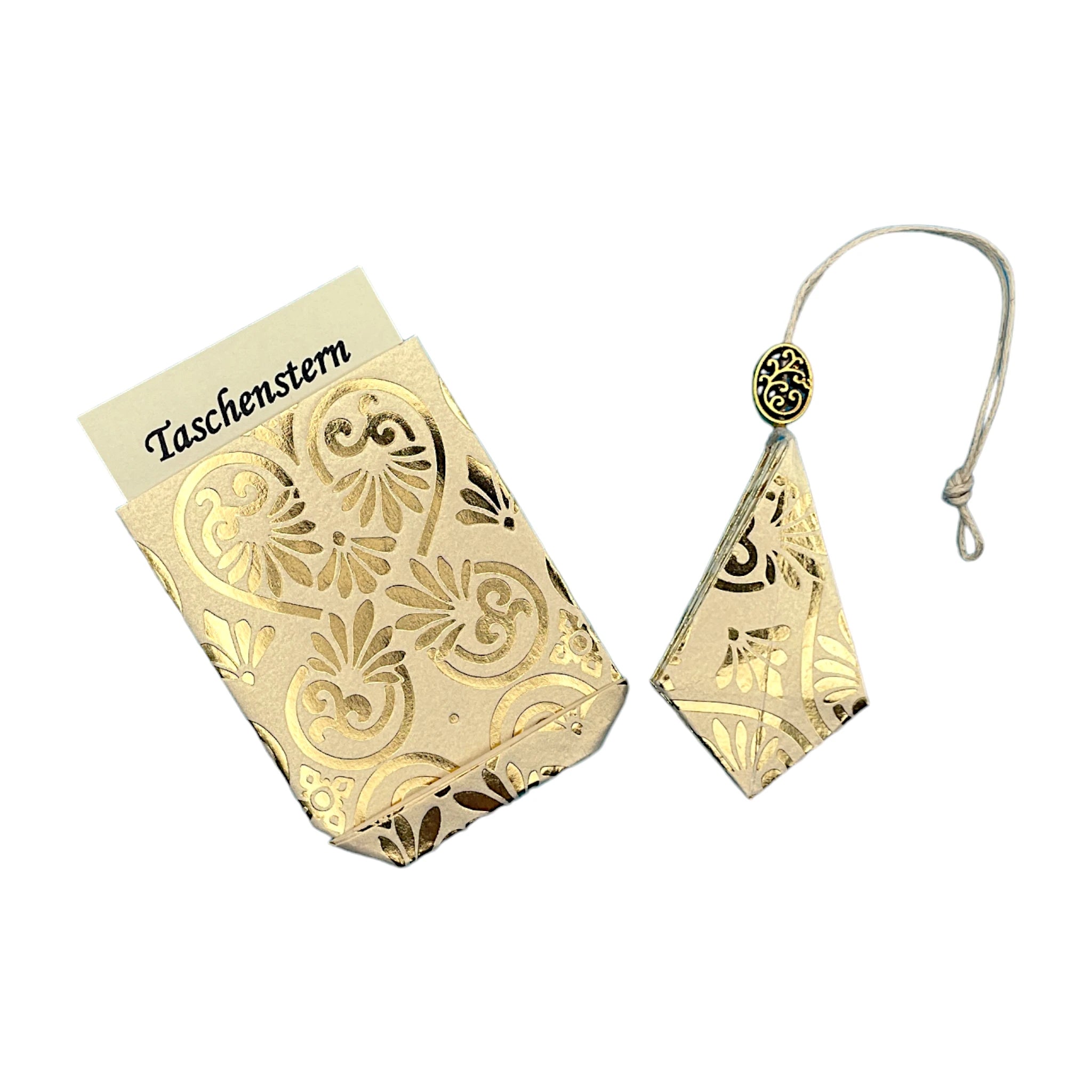 Zusammengelegter Papierstern in Creme mit feinem Golddruck, sicher im Etui verstaut