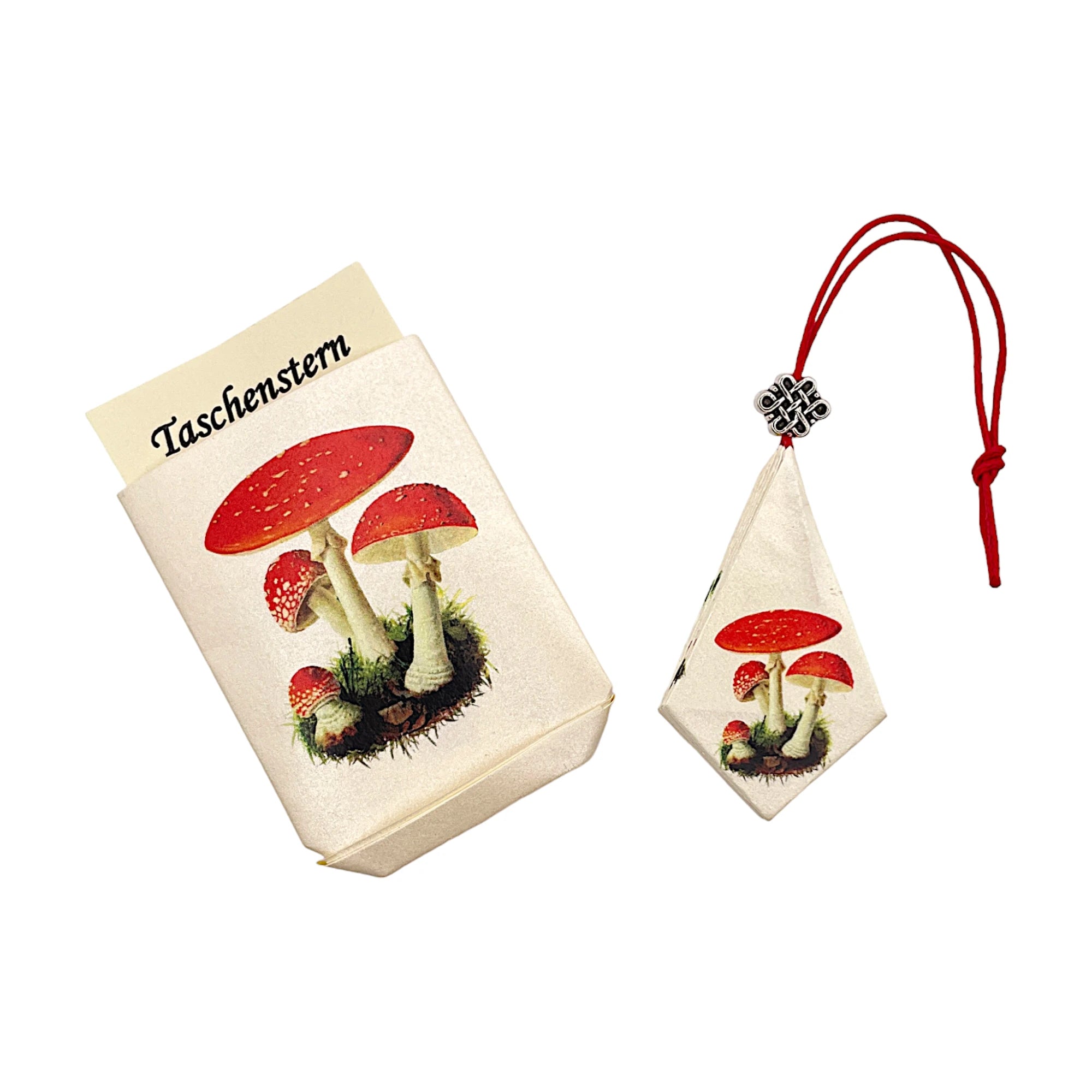 Zusammengelegter Papierstern mit Fliegenpilz-Design, sicher im Etui verpackt
