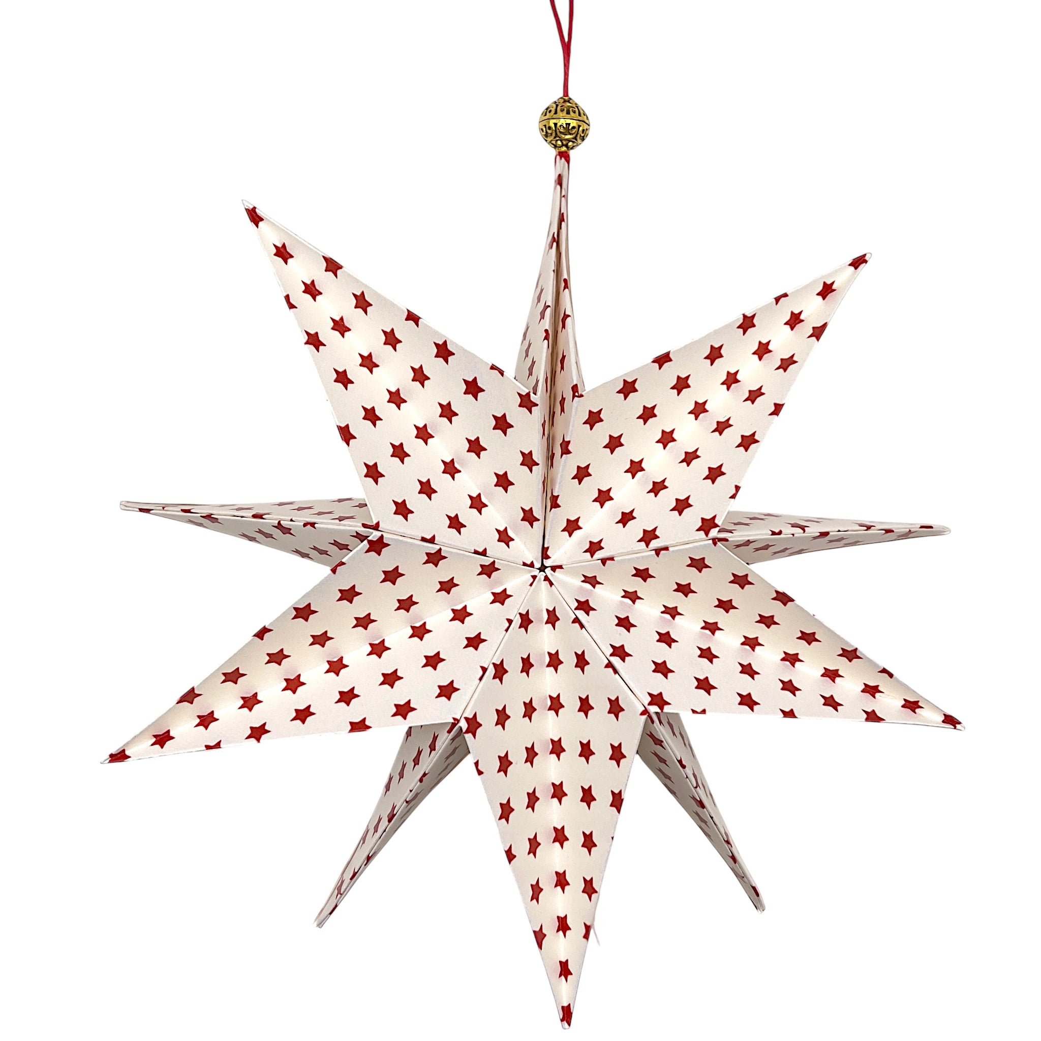 Handgefalteter Papierstern in Goldweiß mit roten Sternen als festliche Weihnachtsdekoration.