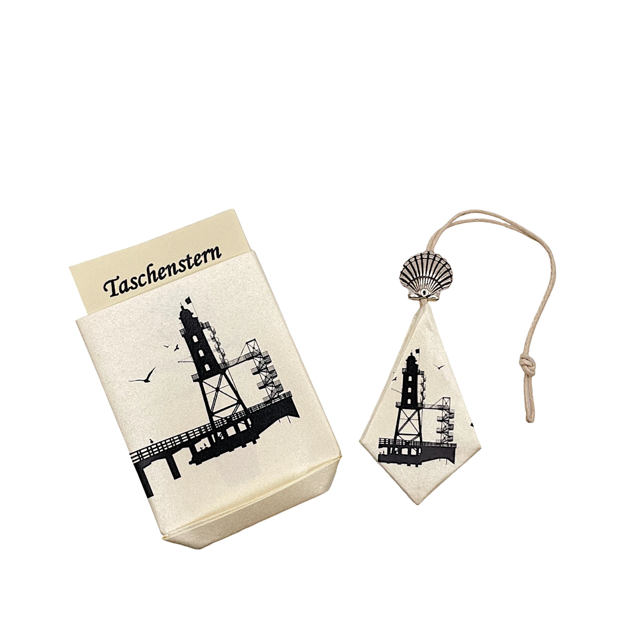 Zusammengelegter Papierstern mit Leuchtturm-Motiv, sicher verpackt im Etui