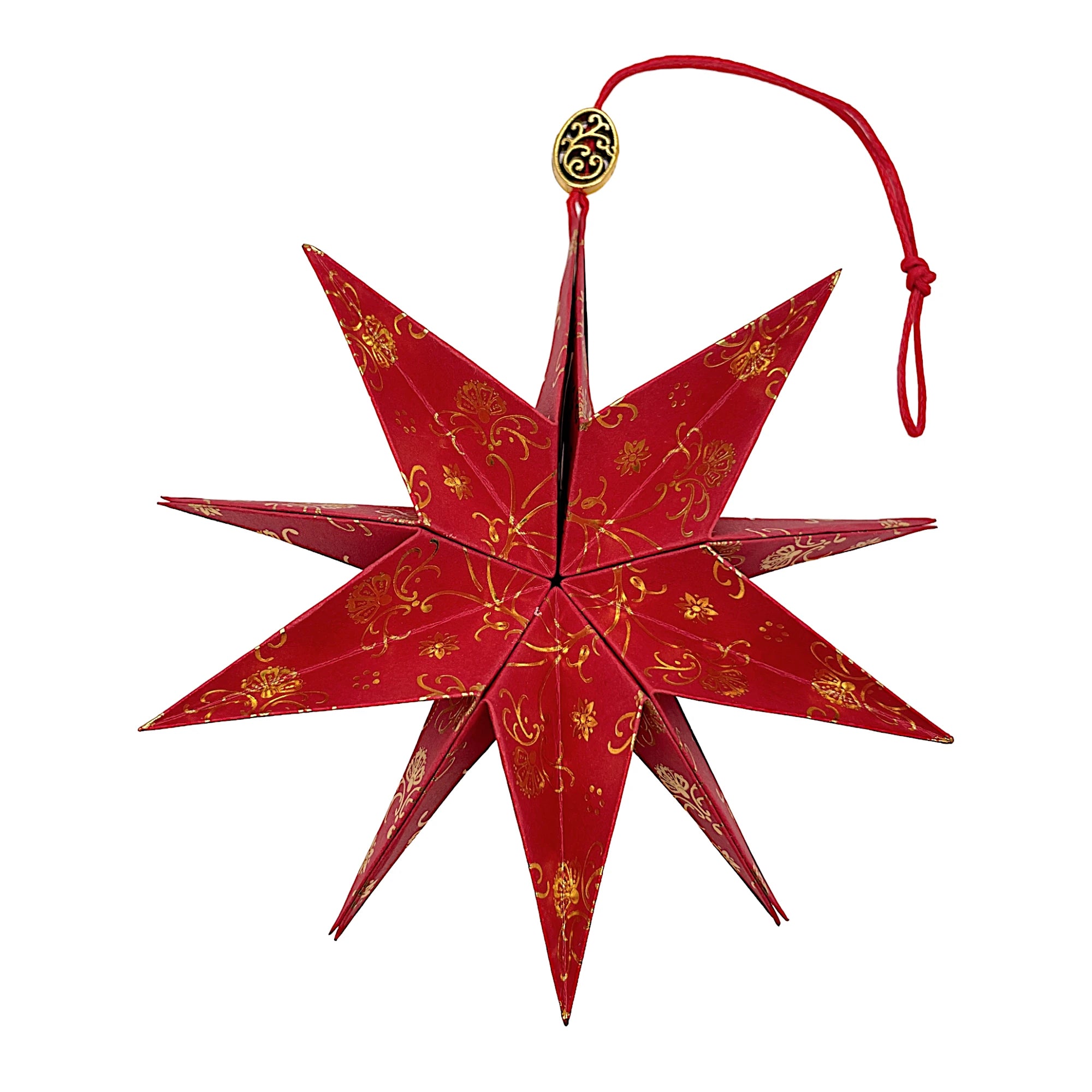 Papierstern aus rotem Papier mit glänzendem Golddruck – kunstvoll entfaltet und edel