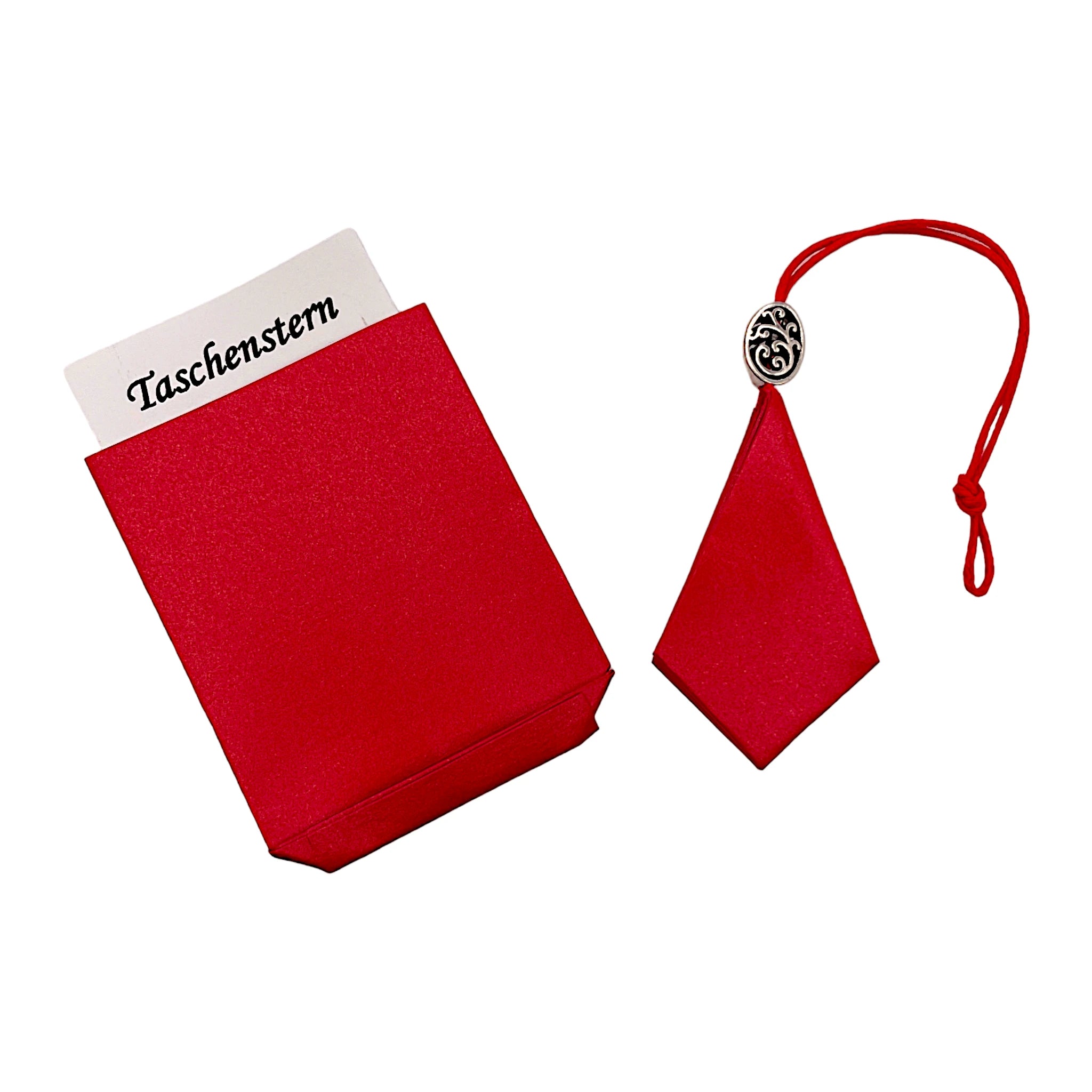 Zusammengelegter roter Papierstern mit Glanzoptik, stilvoll im Etui verstaut