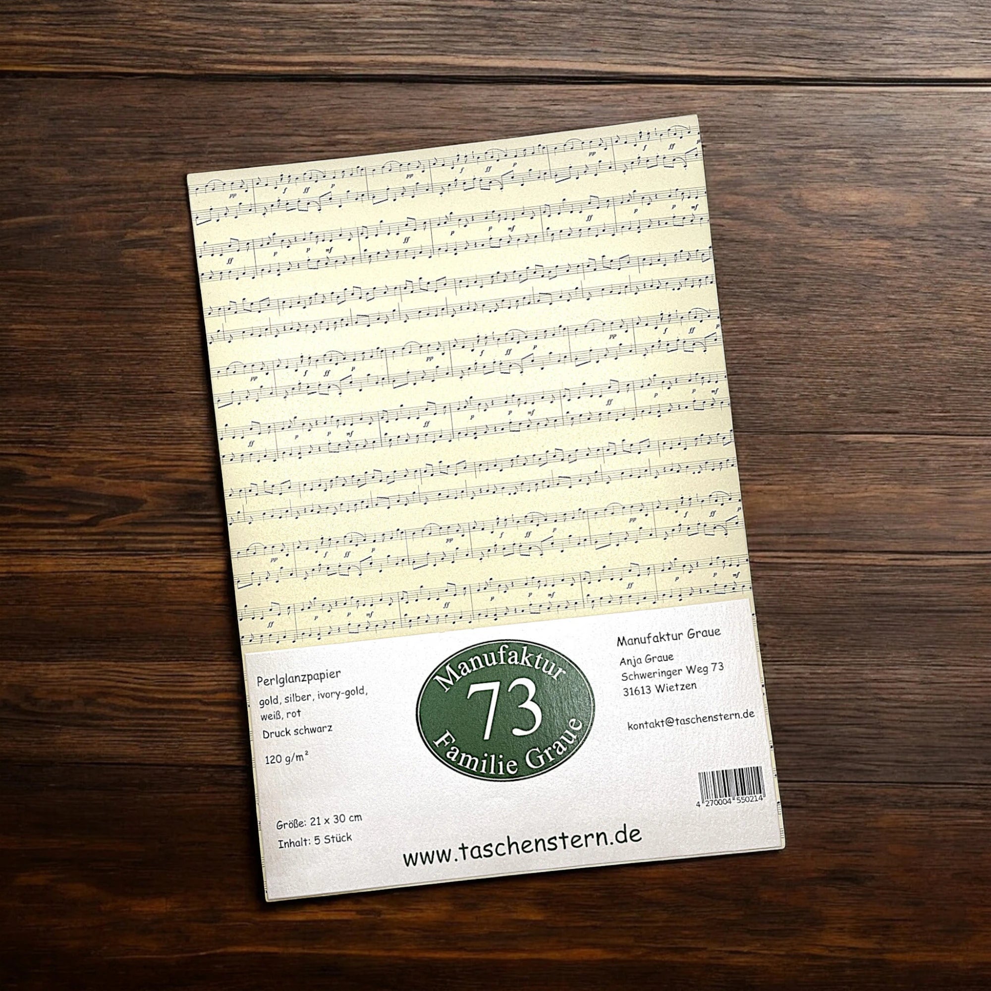 Verkaufsverpackung mit Papier und Notendruck – cremefarbenes Blatt mit Etikett sichtbar