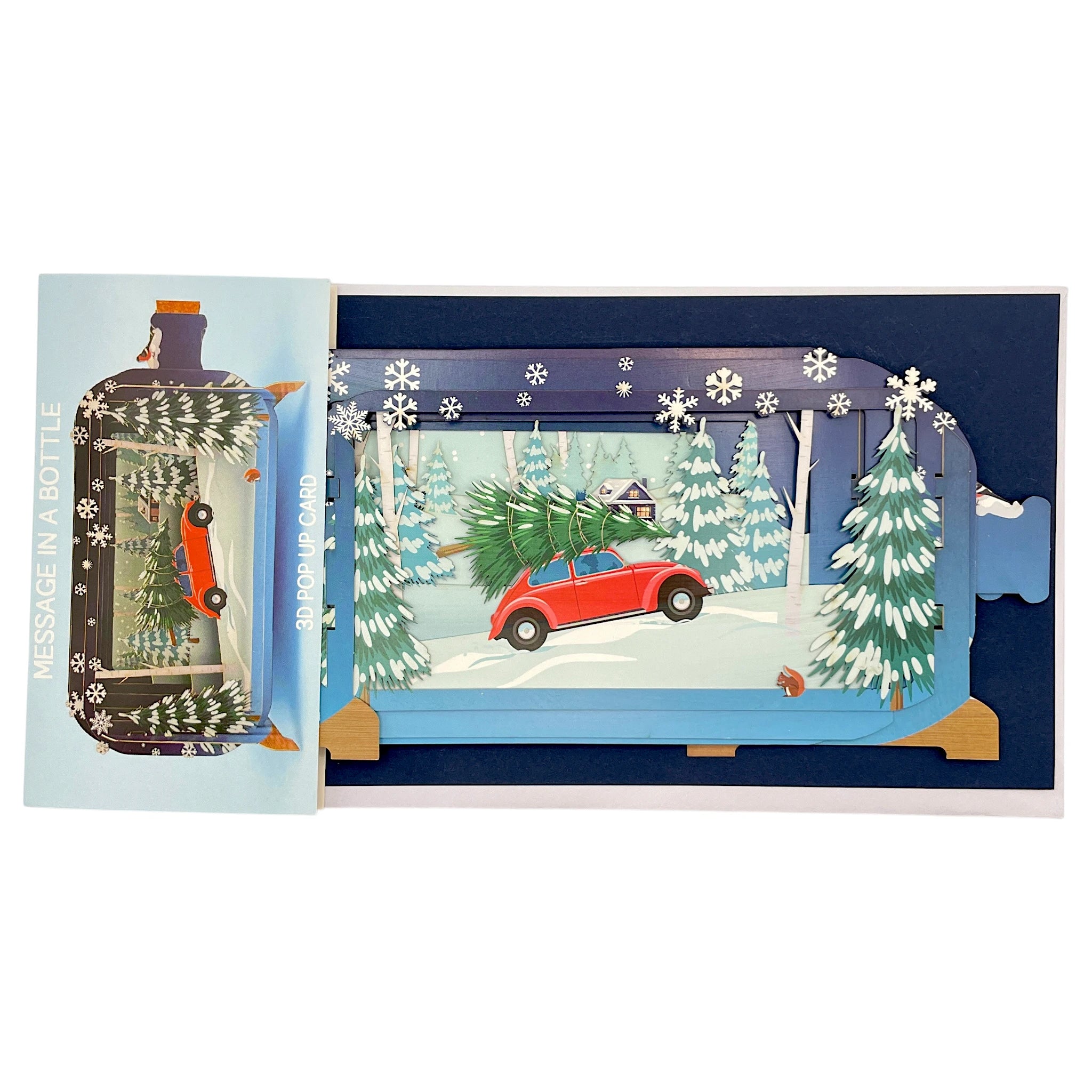 Weihnachtskarte als 3D Pop-up mit rotem Auto und Tannenbaum in verschneiter Landschaft.