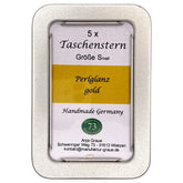 Zusammengefalteter Papierstern Mini in Gold sicher aufbewahrt in einer eleganten Schmuckdose