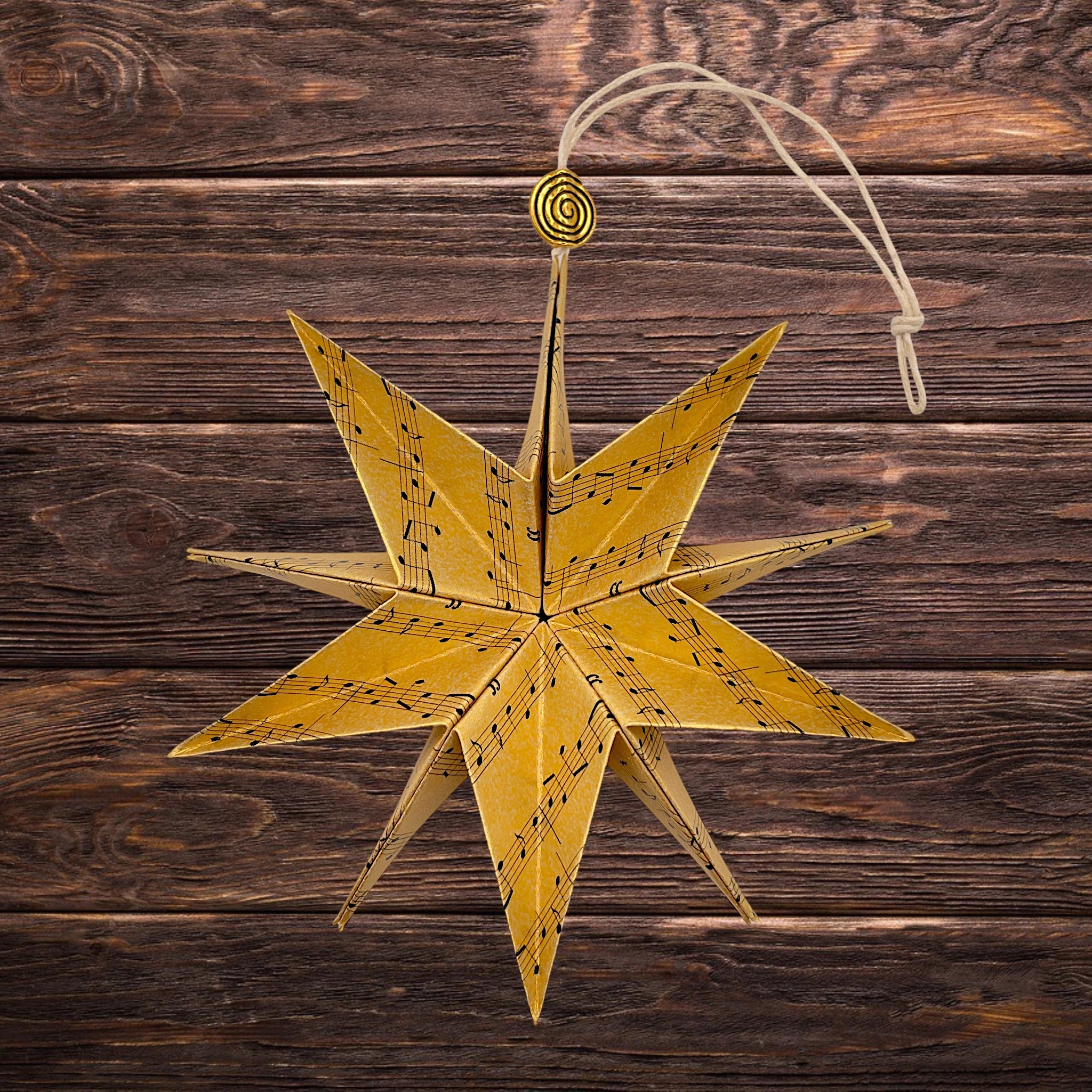 Goliger Weihnachtsstern mit Noten als Papierstern oder Stern