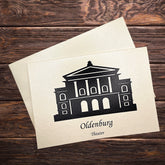 Klappkarte auf dem Holztisch mit dem Druck Theater Oldenburg