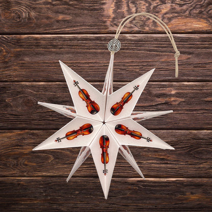 Violine auf einem Papierstern zu Weihnachten