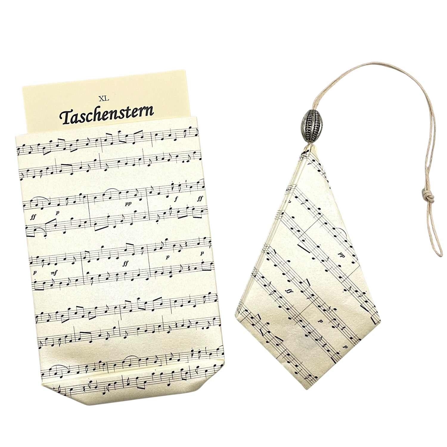 Noten auf einem Papierstern aus Handarbeit