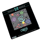 Puzzlebox „Bunte Kringel“ von Curiosi, Edition Q Pop 1 mit poppigem Kringelmotiv und 70 einzigartig geformten Puzzleteilen.