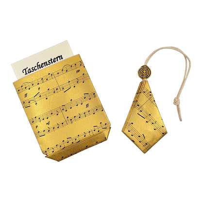 Weihnachsstern in gold mit Noten bedruckt