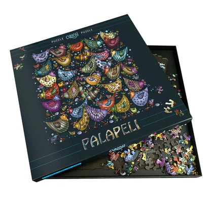 Curiosi Puzzle „Hühnerhaufen“ mit geöffneter Puzzlebox und einzigartigen Puzzleteilen.