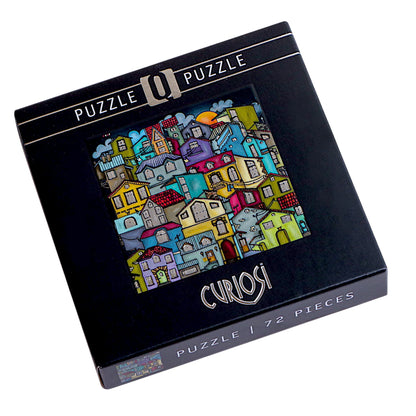 Puzzlekarton des Curiosi-Puzzles „Kunterbunte Stadt“ mit farbenfrohem Stadtmotiv.
