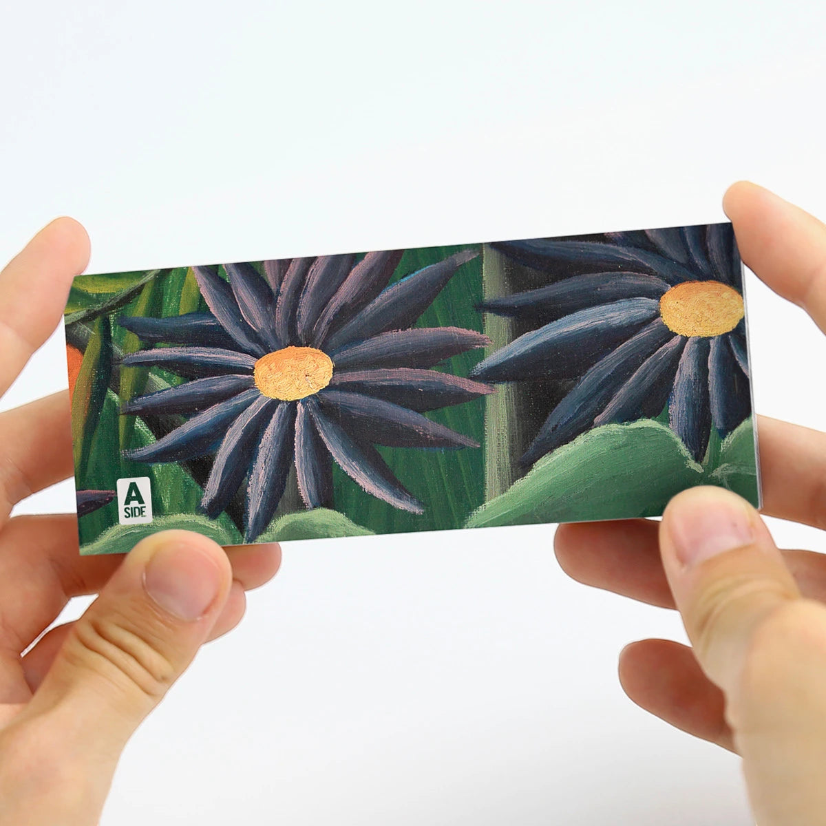 Detailansicht des 6-in-1 Daumenkinos mit Illustrationen im Stil von Henri Rousseau.
