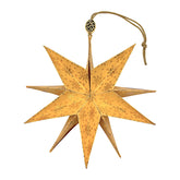 Papierstern mit goldenem Weihnachtsmuster, kunstvoll entfaltet mit edlem Glanz  
