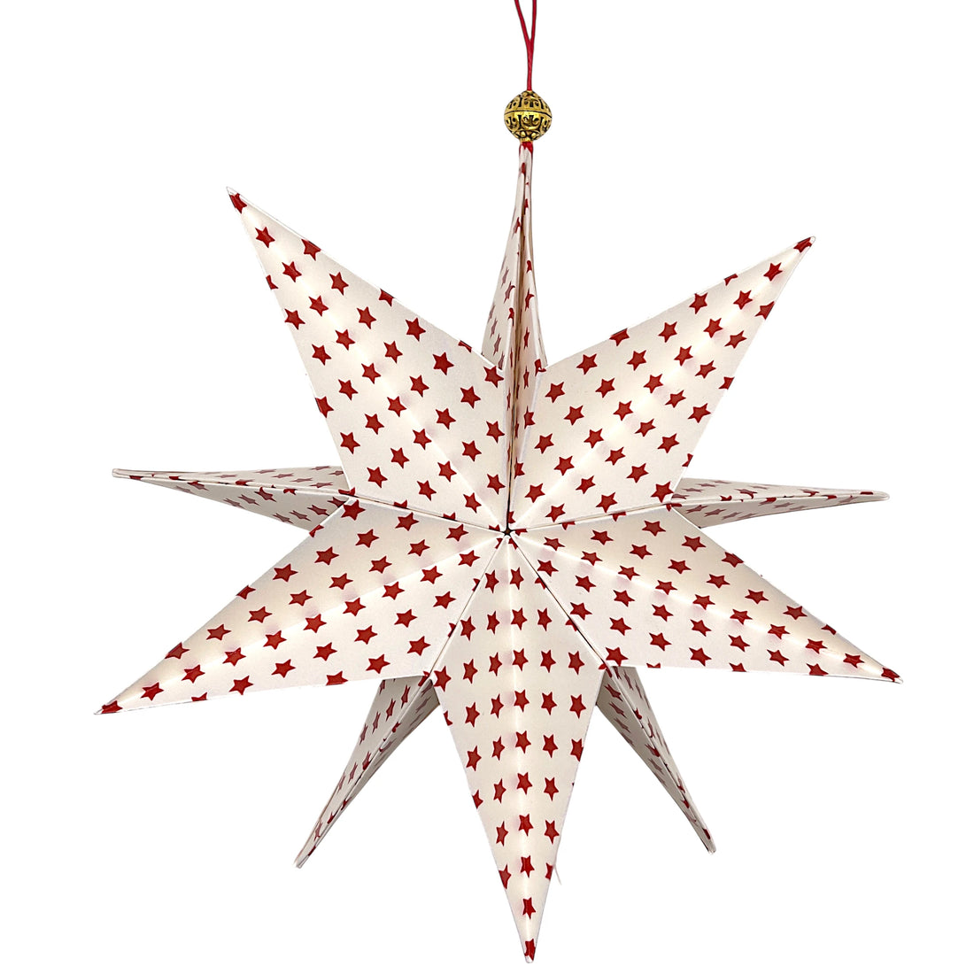 Handgefalteter Papierstern in Goldweiß mit roten Sternen als festliche Weihnachtsdekoration.