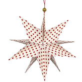 Handgefalteter Papierstern in Goldweiß mit roten Sternen als festliche Weihnachtsdekoration.